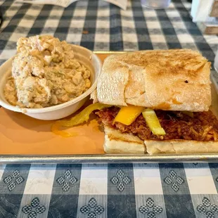 Firebird sandwich with a side of potato salad
