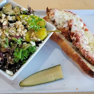 Chicken Parmigan sandwich with Greek salad