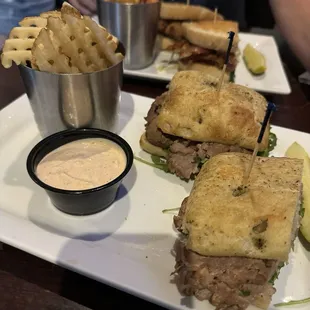 The Manzo: Seasonal menu item. Thinly sliced roast beef sandwich on grilled focaccia bread. Waffle fries and seasoned sour cream.
