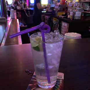 a drink with a purple straw