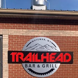 a sign on the side of a brick building
