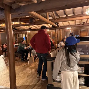 a woman in a white robe and a man in a red jacket