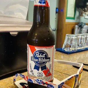 a bottle of beer and sunglasses