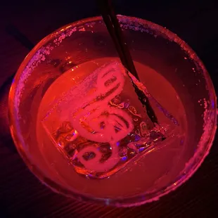 an ice cube in a bowl with chopsticks