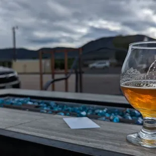 a glass of beer on a table