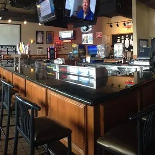 bar seating and televisions