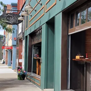 Out front, cool garage type doors that open up onto the sidewalk out front. Best combination of eating inside yet outside.