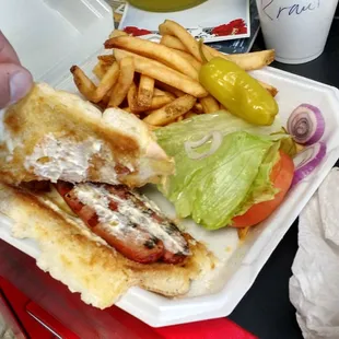 This is my hot dog Reuben Style with lots of butter and no sauerkraut instead I get tomato lettuce and onions