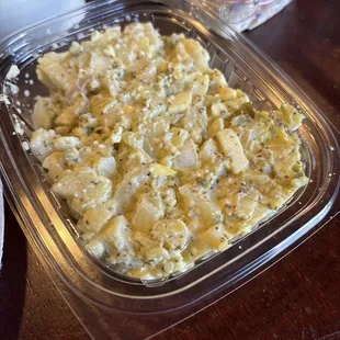 Potato salad, lots of onions and mustard base.