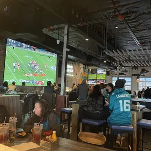 a group of people watching a football game