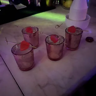 four glasses of cocktail