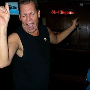 a man with his arms in the air