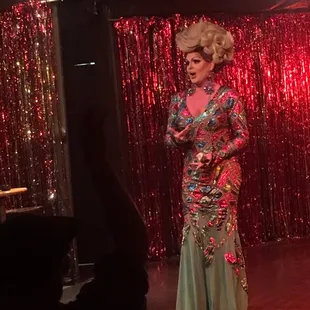 a woman in a dress on a stage
