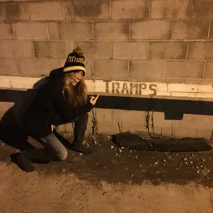 a woman kneeling on the ground