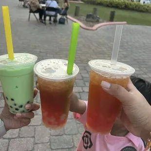 Honey dew bubble tea and fruit teas with jelly.