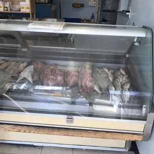 Lawnmower with grass stored feet away from fish counter. Yuck