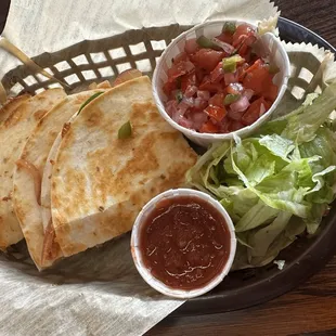 Quesadilla with a side of pico de gallo.