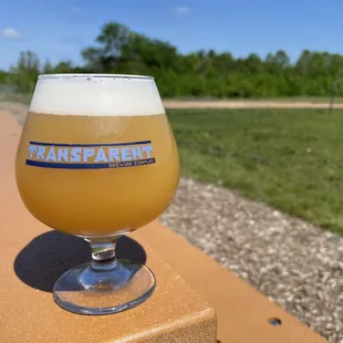 a glass of beer on a table