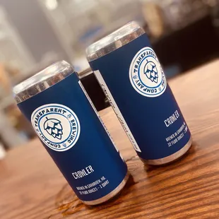 two cans of beer on a table