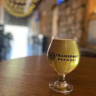a glass of beer on a table