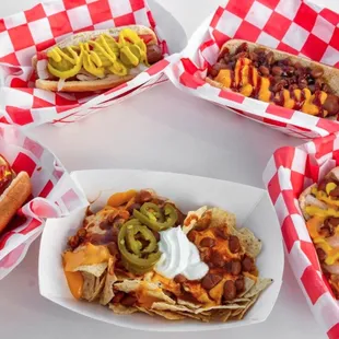 a variety of hotdogs and nachos