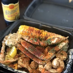 crab legs and corn on the cob