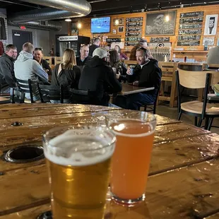 a pint of beer on a wooden table