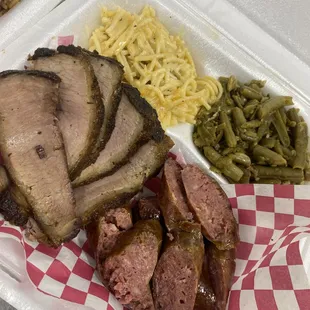 meat and sides in a styrofoam container
