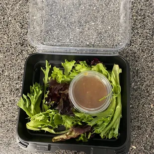 Our forgotten salad, cute but small. Wish we had enough salad with the amount of dressing in the container.