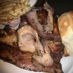 a plate of meat and french fries