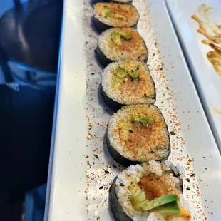 a row of sushi rolls