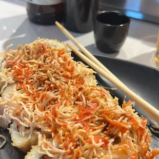 Bonnie roll. All rice and nasty shredded crab with a K.You can only order one at a time and it blows you up with rice!