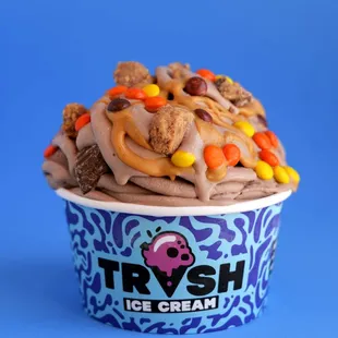 #1: What's Love Got To Do With It: chocolate ice cream with peanut butter cups, Reese's Pieces, and ooey gooey peanut butter drizzle.