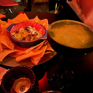 a bowl of soup and tortillas