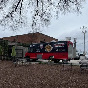 a food truck parked in front of a building