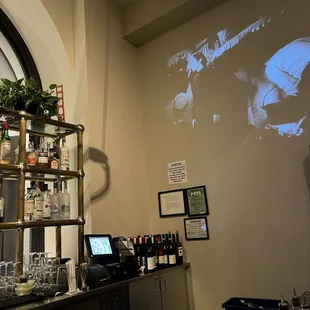 a bar with a lot of bottles and glasses