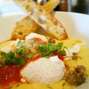 Poached eggs, fennel sausage, Parmesan,  tomato gravy, creamy polenta