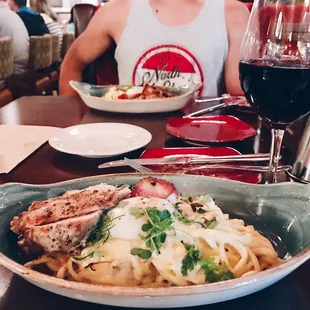 Chicken carbonara and wine imported from Sicily, Italy