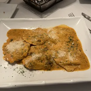 a plate of ravierole with cheese and parmesan