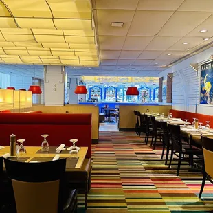 a dining area with tables and chairs