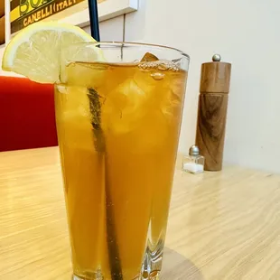 a glass of lemonade on a table