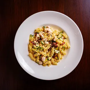 a plate of pasta with chicken