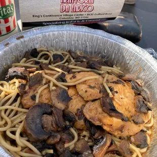 a bowl of pasta and mushrooms