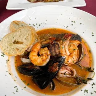 a plate of seafood and bread