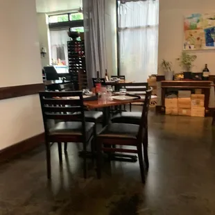 a dinning room with tables and chairs