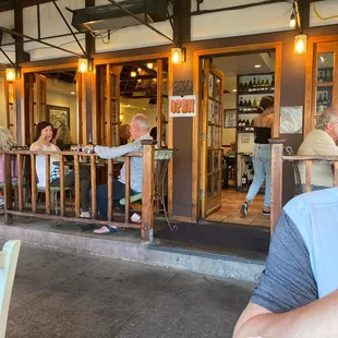 people sitting outside a restaurant