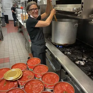 Our mom preparing the marinara sauce