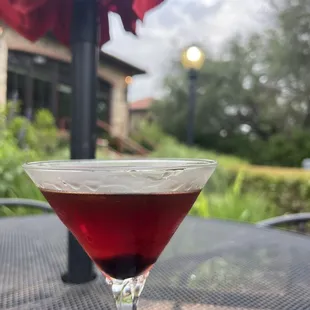 a glass of wine on a table
