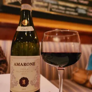 a bottle of wine and a glass of wine
