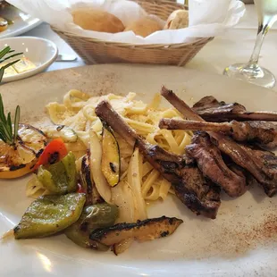 Rack of lamb. Pasta, and roasted vegetables